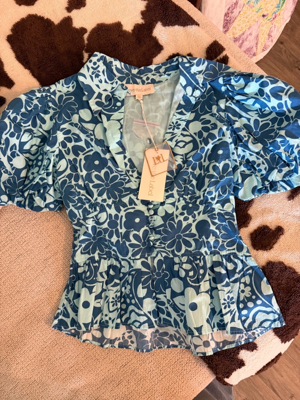 Blue Floral Peplum Blouse with V-Neck and Puff Sleeves